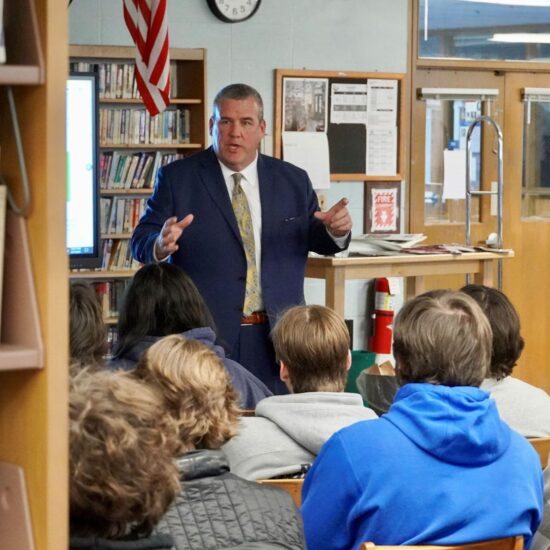 Rhode Island Secretary of State Gregg Amore talking with students in middletown high school library