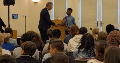 Governor Ned Lamont and Kid Governor Keudy Martinez speak with students
